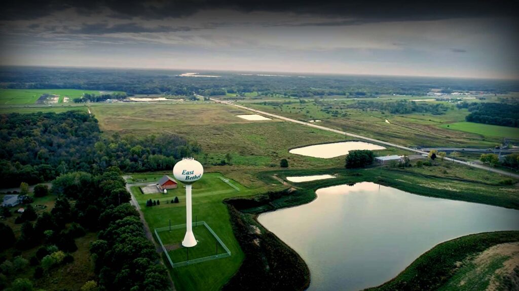 Aerial view of East Bethel, MN with Destination Church banner location near water tower